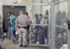 Kids Taunted — DHS Denies Everything Detention facility with people behind chain-link fence and officer nearby