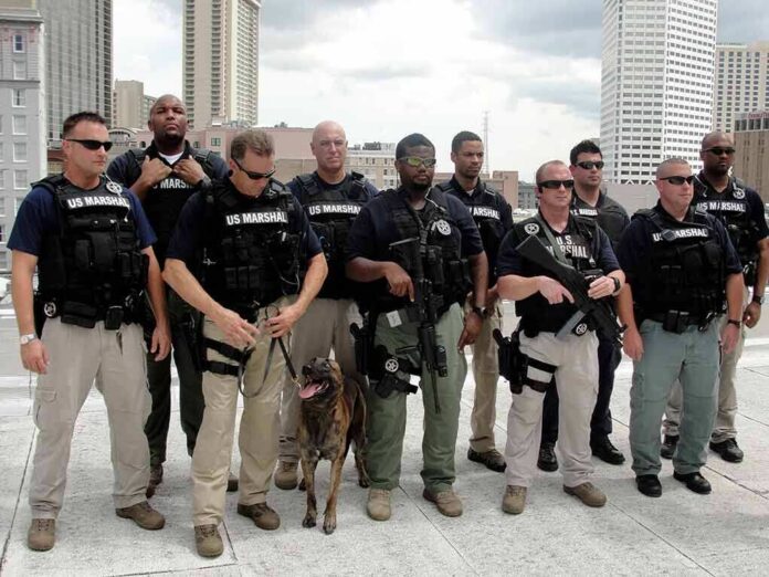 Group of law enforcement officers with tactical gear and a K-9