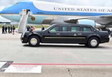 Trump Used Air Force One as Decoy After Iranian Assassination Threat Presidential motorcade limousine parked beside large blue and white aircraft