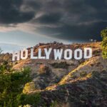 Hollywood sign on hillside under dramatic clouds