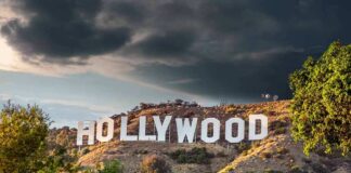 Hollywood sign on hillside under dramatic clouds