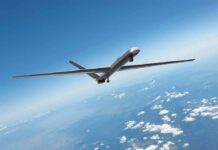 Spy Plane Quietly Tracking Phones Along Southern Border Unmanned aerial drone flying high above clouds
