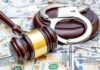 Cornell Fraternity Brothers Drugged, Gang-Raped Student Judge's gavel and handcuffs on pile of US dollar bills