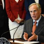 Why Texas Race Is Bigger Than One Senate Seat man in suit speaking at a podium with a microphone