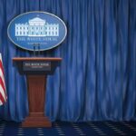 Power Play: Trump Picks America’s Top Spy White House press briefing podium with U.S. flag and blue curtain