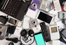 Assorted electronic gadgets and accessories on a white surface