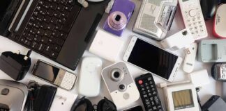 Assorted electronic gadgets and accessories on a white surface
