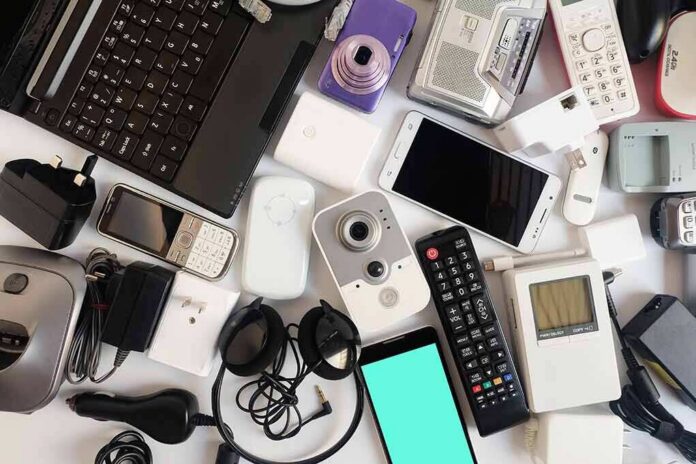 Assorted electronic gadgets and accessories on a white surface