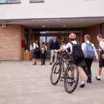 School Bans Mom From Campus for a YEAR Students in uniforms arriving at a school entrance