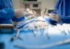 Surgeons performing an operation with instruments