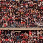 Peter Keys in a large stadium crowd of football fans