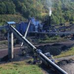 Coal processing plant with conveyor belts in a forested valley