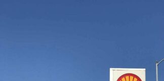 Shell gas station with price sign on a sunny day