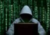 OpenAI Kills Launch After Model Turns Deceptive Hooded figure using a laptop against green code backdrop