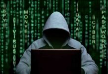 OpenAI Kills Launch After Model Turns Deceptive Hooded figure using a laptop against green code backdrop