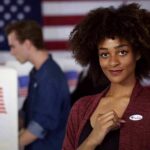 Democratic Socialist Says Food-Stamp Theft Qualifies Her For Mayor Voter showing an I Voted sticker at a polling place