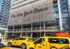 New York Times building with yellow taxis in front