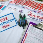DSA Endorsement Triggers LA Power Brawl Voter registration table with forms, pens, and informational materials