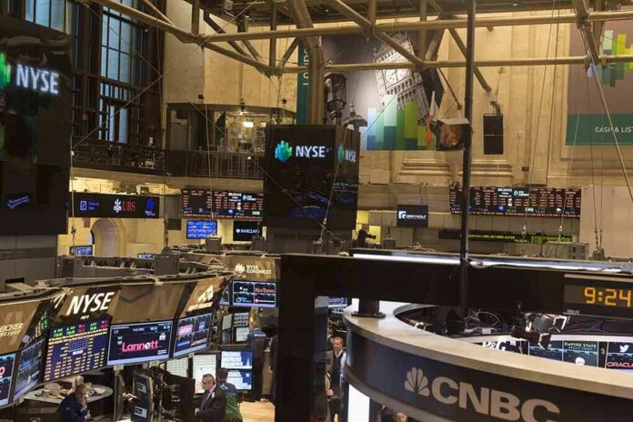 shutterstock_181756625 NYSE trading floor with monitors and tickers