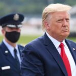 Trump Draws Blood-For-Blood Line Donald Trump walking outdoors with an officer behind him; Chuck Howley not visible