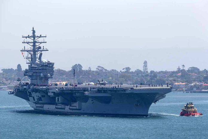 Aircraft carrier escorted by a tugboat in a harbor