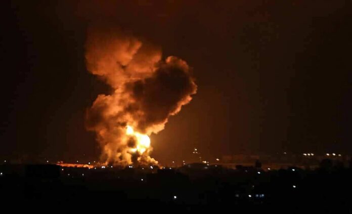 Large explosion with fireball and smoke at night