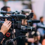 Trump’s Crypto Empire Paid Off Big Video cameras on tripods at a media event