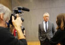 RFK Jr. Discloses $250K+ in Gifts From Major Donor Robert F. Kennedy Jr. speaks with a reporter while being filmed indoors