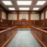 Attempted Murder Charge Triggers Riots Empty courtroom with wooden benches and judge's bench