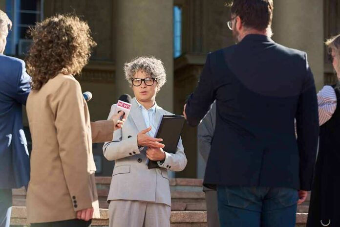 Spokesperson addresses reporters on courthouse steps