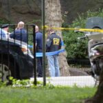 White House UFC Plot? Explosive Twist Emerges law enforcement officers gather at taped-off outdoor scene