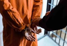 Nancy Mace May Have Been Telling the TRUTH Prisoner in orange jumpsuit handcuffed by officer