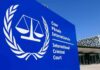 Rubio Hits International Criminal Court With SANCTIONS International Criminal Court sign with scales emblem outside modern building