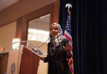 Trump Admin Claims ‘STRONG Case’ Against Ilhan Omar Ilhan Omar speaking at a podium with a microphone
