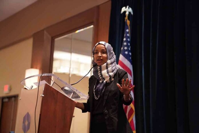 Ilhan Omar speaking at a podium with a microphone