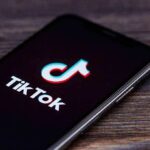 smartphone displaying the TikTok app logo on screen