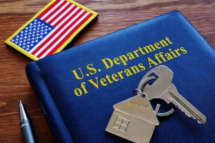VA folder with house keychain and US flag patch on wooden desk