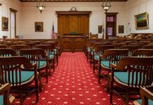 NFL Star’s Comeback Derailed By Court Courtroom with wooden benches facing the judge's bench