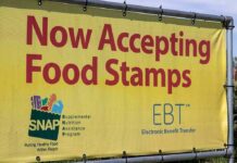 Yellow banner announcing acceptance of food stamps and EBT
