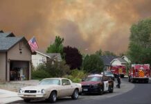 Chemical Leak Forced 50,000 to FLEE Emergency vehicles respond to wildfire near suburban homes