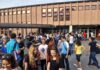 School Cafeteria Scare Leads to TERROR Charges Students gathered outside a school building entrance
