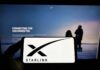 Why Phone Carriers Should FEAR Musk’s Starlink Smartphone showing Starlink logo in front of a computer screen