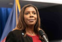 Woman speaking at a press conference microphone