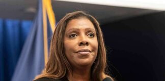 Woman speaking at a press conference microphone