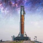 Rocket on launch pad under starry sky