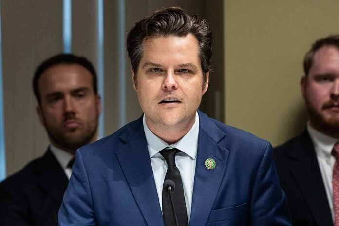 Matt Gaetz speaking at a microphone during a formal meeting