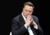 Trump Honors Elon Musk With National Science Medal Elon Musk seated in a dark setting with hands steepled near his face