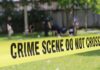Teen Runners Make GRIM Discovery in Park crime scene tape cordoning off a grassy area