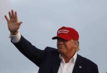 Trump UNLOADS on Protesters Who Crashed Rally Donald Trump waving in a red cap