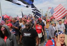Former YouTube Star Takes Over Trump RALLY Dennis Erickson, Carlos Hyde, and Danny Hope among a crowd at a patriotic rally